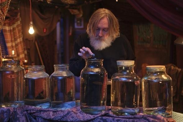 Pearce Quigley taking care of his homonculi in his backyard shed.